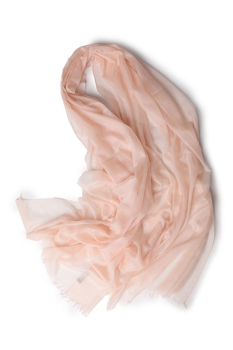 The looselyboho Blush Rose 100% Cashmere Scarf is a sheer, blush pink accessory with lightly unfinished edges—an elegant and lightweight winter piece that adds softness and luxury to any look.