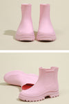 Two images of pink Non-Slip Rain Boots with looselyboho SuperGrip Soles. The top image shows the boots standing upright side by side, viewed from the front. The bottom image reveals their waterproof design: one boot lies on its side, showcasing the sole and super grip quality, while the other stands upright to display the outer side.