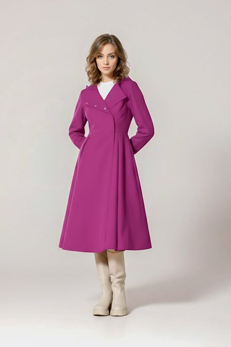 A woman with shoulder-length wavy hair models the looselyboho Water-Repellent Rain & Shine A-Line Hooded Raincoat in magenta, paired with a white top and high boots, standing before a plain light background.